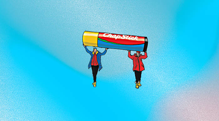 Illustration of two people holding up a tube of chapstick